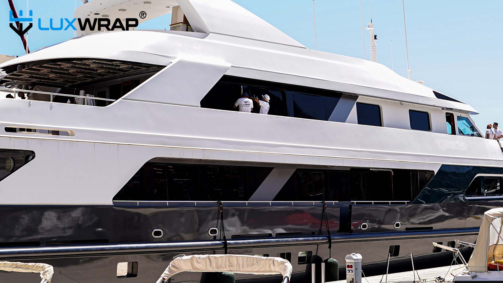 Blackout wrap visually extending window lines on a superstructure