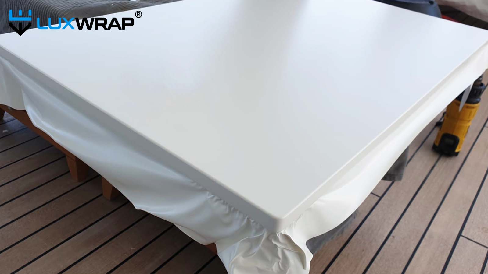 Wrapping deckheads on-site with clean installation