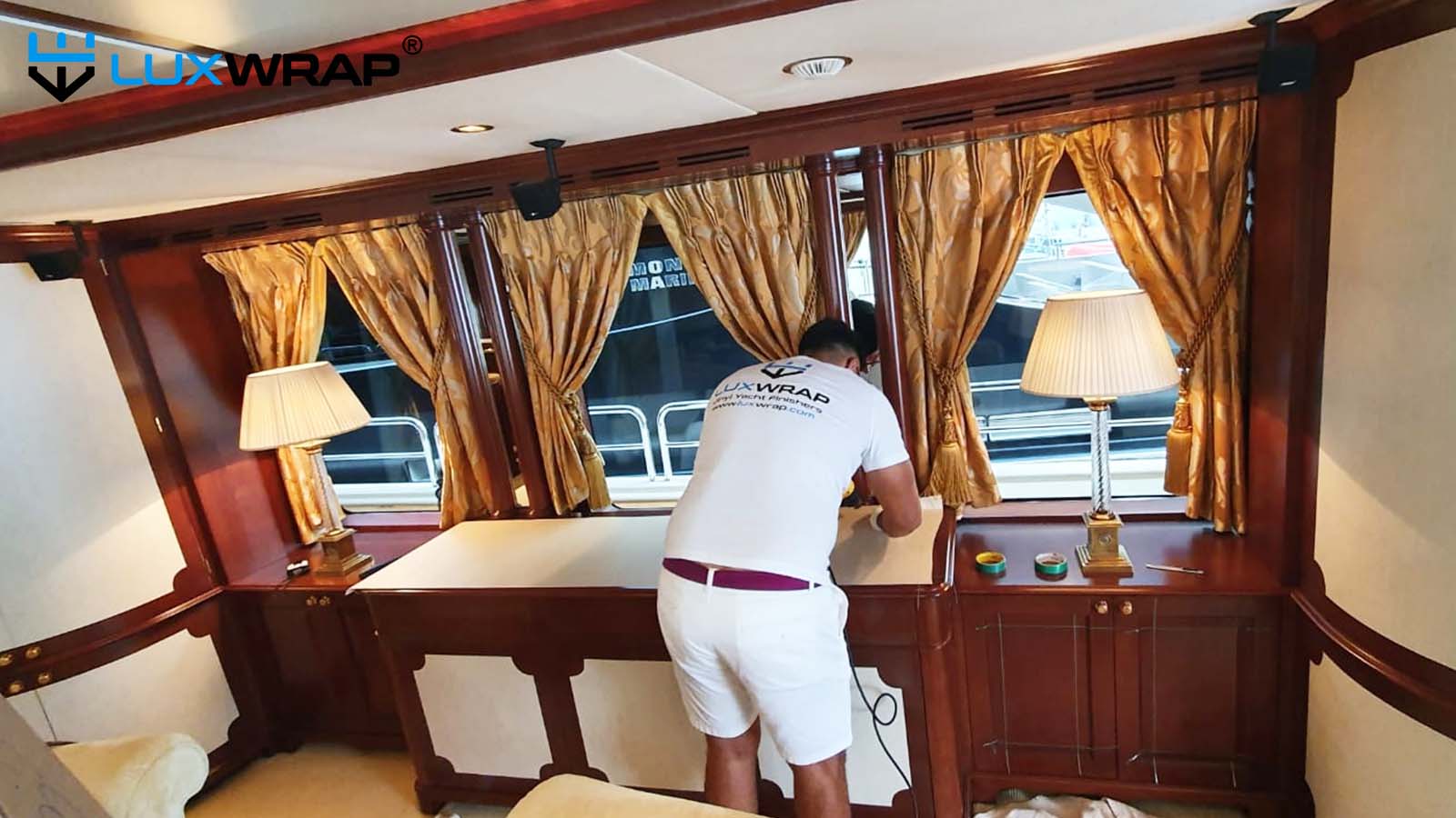 Partial wrap of yacht interior door faces and worktops.