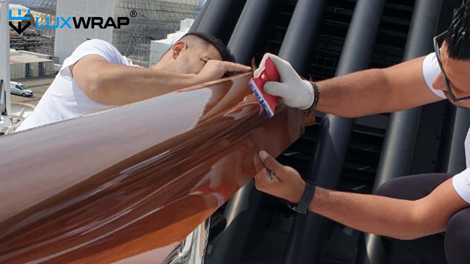 High-gloss woodgrain architectural film protected with NinjaShield PPF in superyacht cap rails
