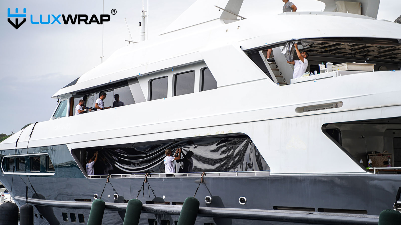 Wrapping white panels between windows to give the appearance of larger windows and modernise vessel lines.