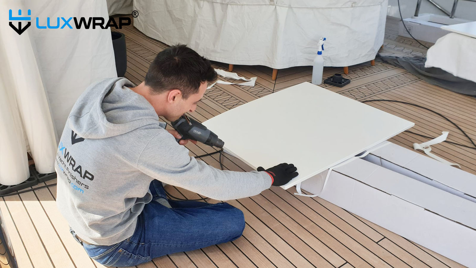 Wrapping superyacht deckheads onboard