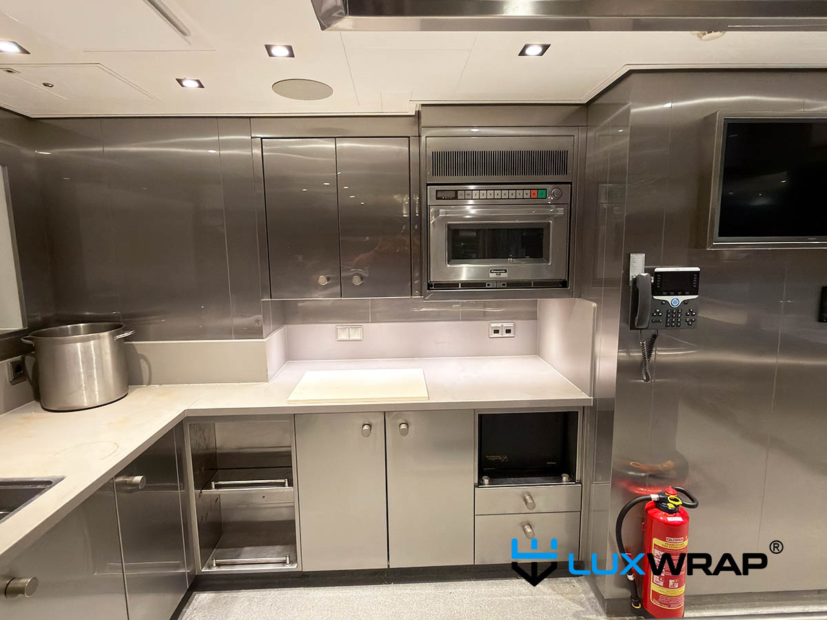 Superyacht galley doors and wall units wrapped in high-gloss NinjaShield PPF surface protection film